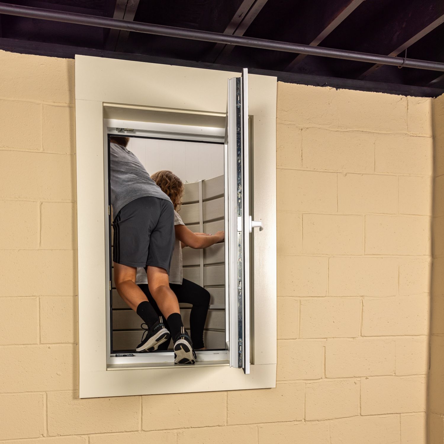kids escaping through an egress window
