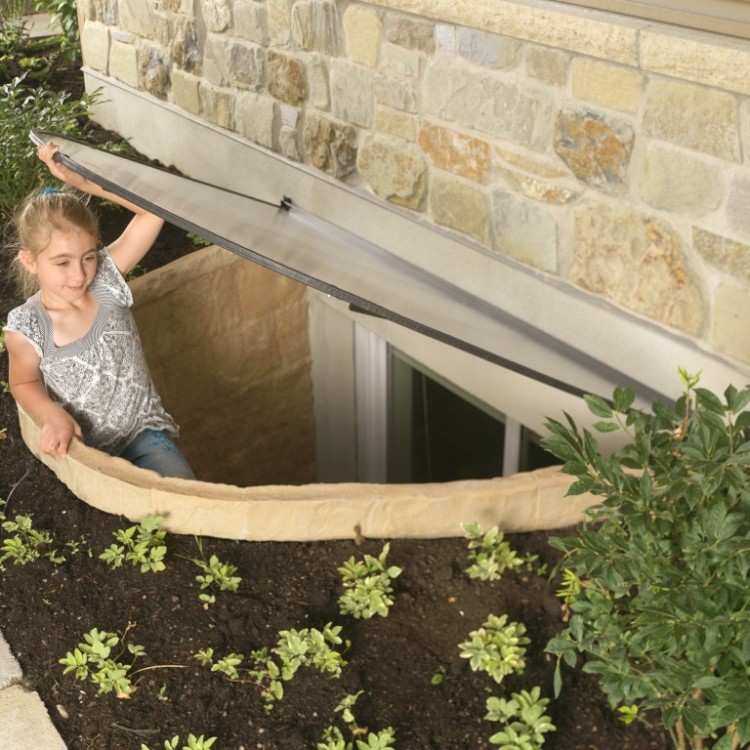 child escaping through an egress window