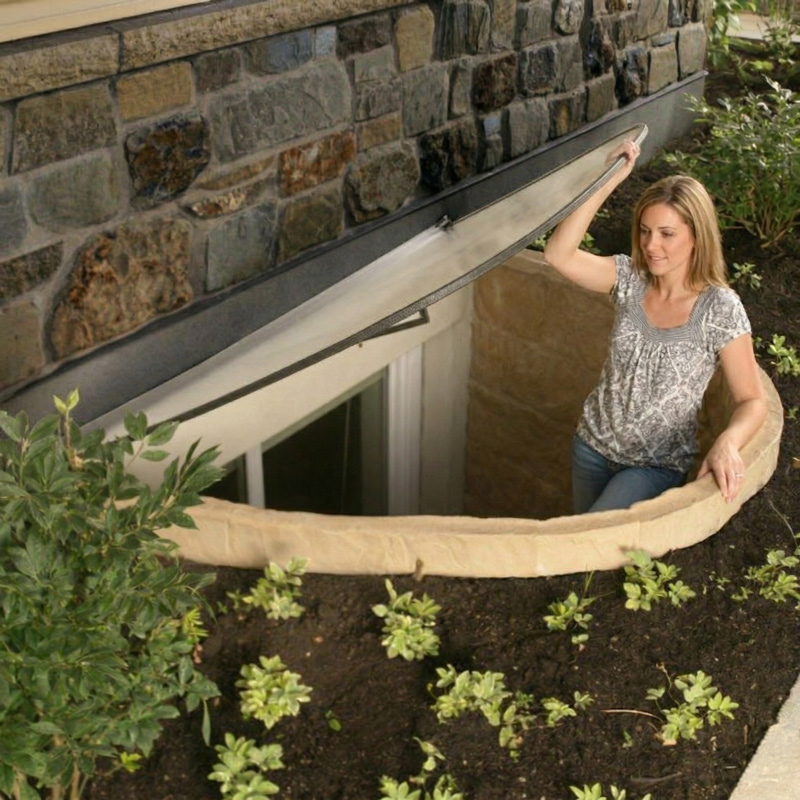 woman escaping through an egress window