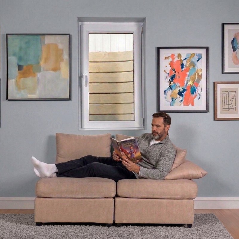 man reading under egress window