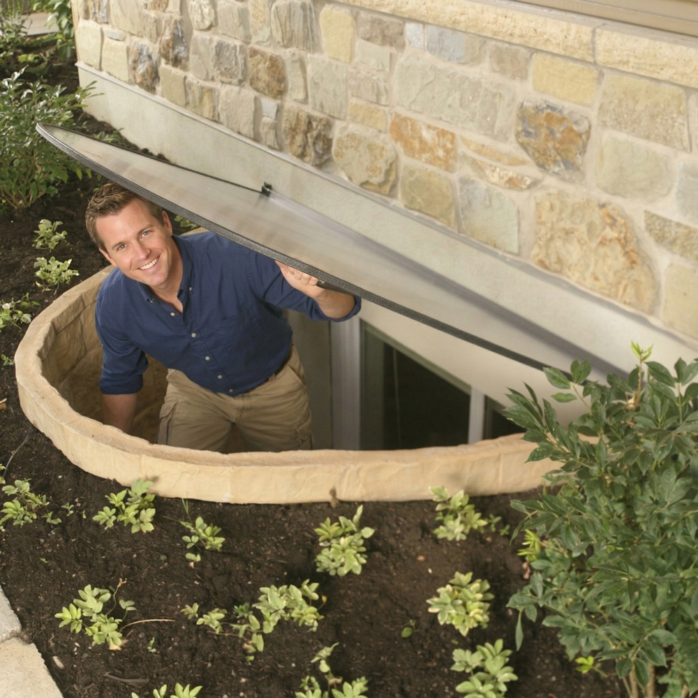 man escaping through an egress window