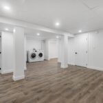 green remodeling basement with bathroom, washer and dryer, closet