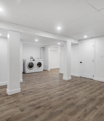 green remodeling basement with bathroom, washer and dryer, closet